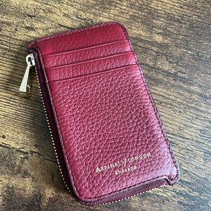 Aspinal of London Zipped Coin and Card Holder in Bordeaux pebble.